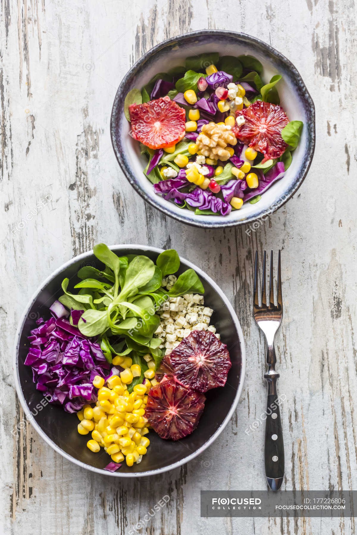 Salads With Lettuce Red Cabbage Corn Feta Cheese Blood Orange Walnuts And Pomegranate Seeds Food Variation Stock Photo 177226806