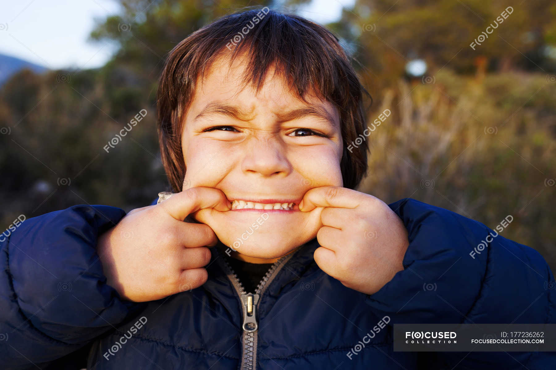 Portrait of little boy pulling funny faces — nature, child - Stock Photo |  #177236262