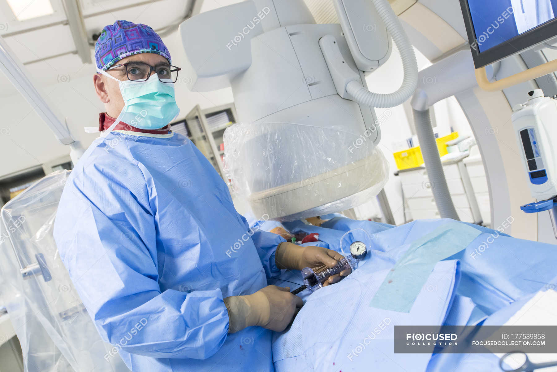 tilted-portrait-of-interventional-radiologist-at-surgery