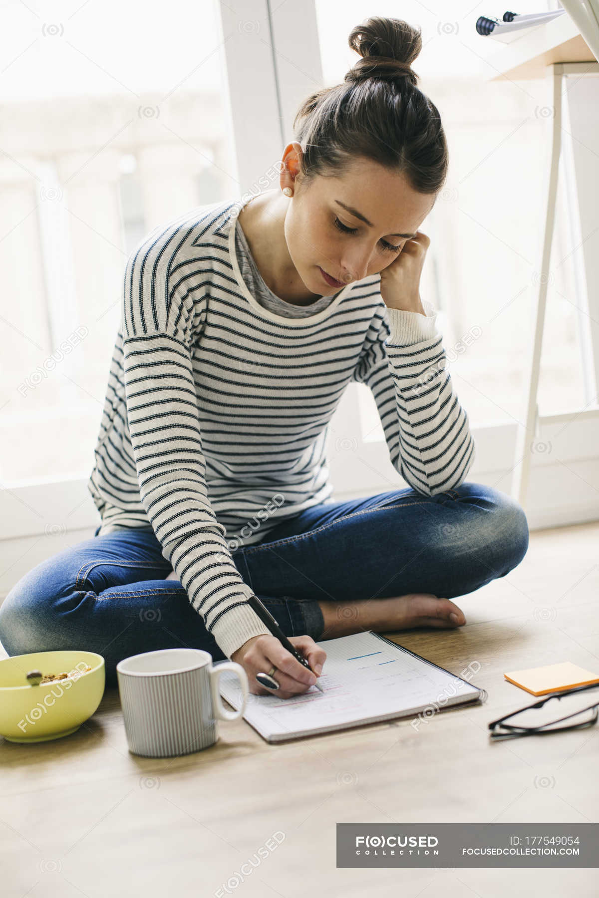 Woman Sitting On Floor And Writing On Notepad Brown Hair Coffee