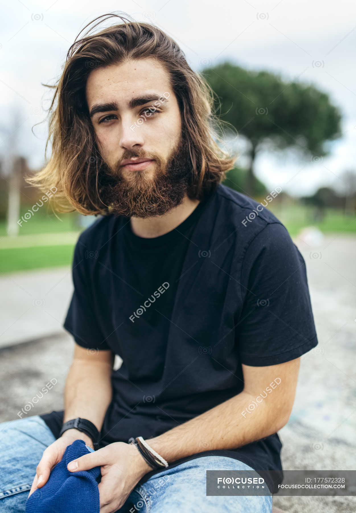 Portrait of bearded young man   half long hair Caucasian 