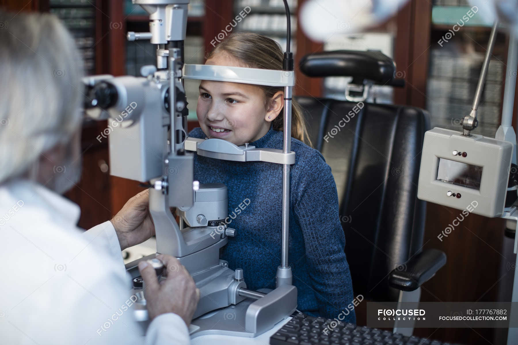 Girl Doing Eye Test At The Optometrist Eyesight Medicine Stock Photo