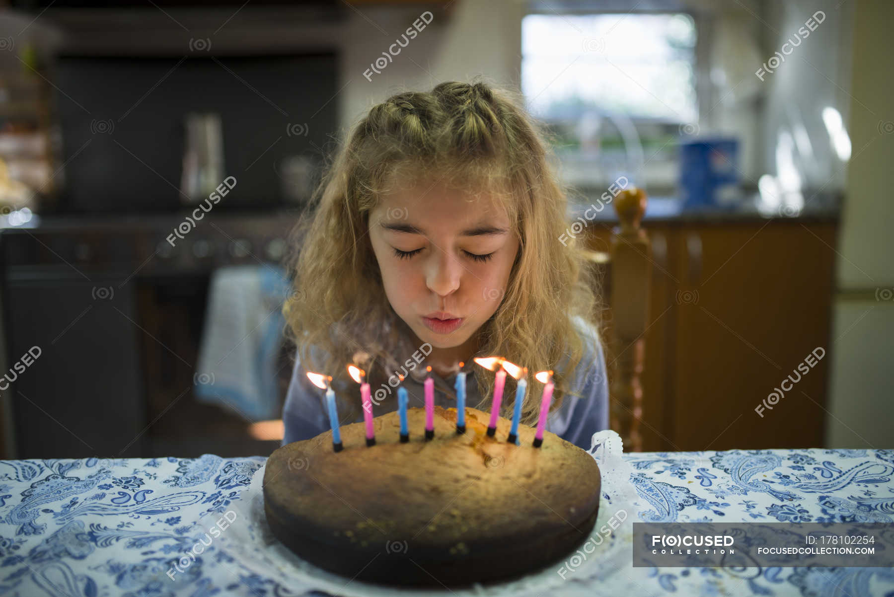 Boy Blowing Out Candles On A Birthday Cake Stock Photo, Picture and Royalty  Free Image. Image 3093210.