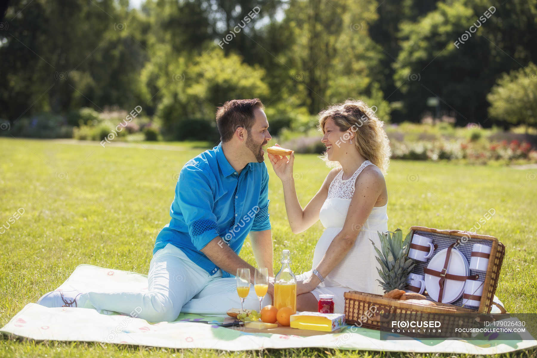 Image of Couple having picnic outdoors