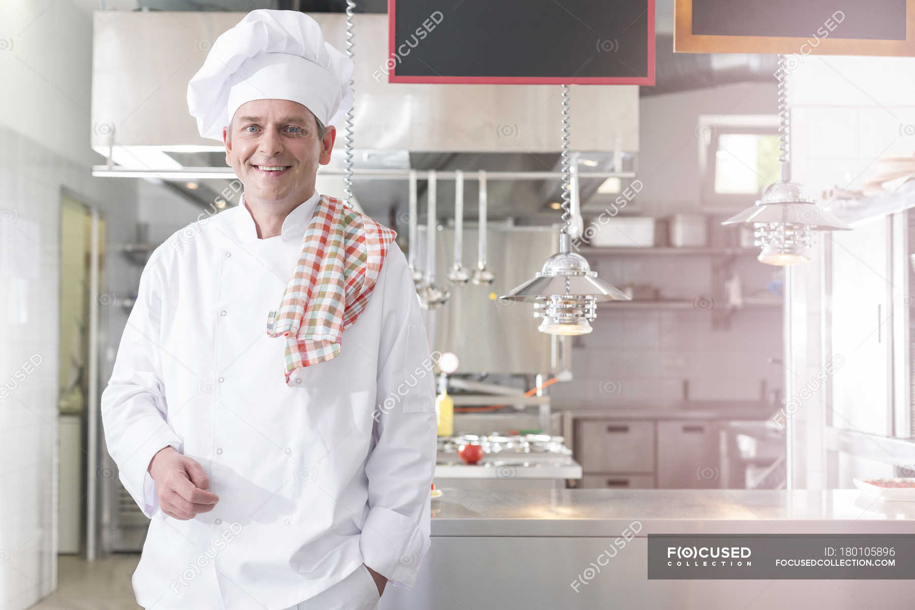 Smiling Chef In Kitchen With Towel On Shoulder Stock Photo Smiling Chef In Kitchen With Towel On Shoulder Stock Photo 180105896