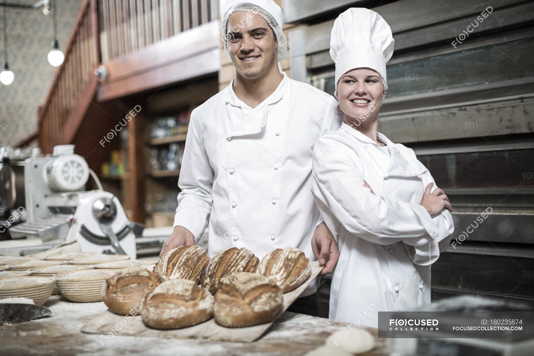 Happy Baker Standing Near Tray With Bread At The Bakery Stock Photo,  Picture and Royalty Free Image. Image 46213780.
