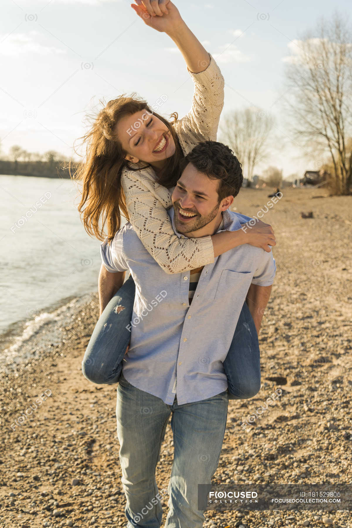 Man Giving Piggyback Ride To His Girlfriend Stock Photo - Image of  cheerful, person: 41022350