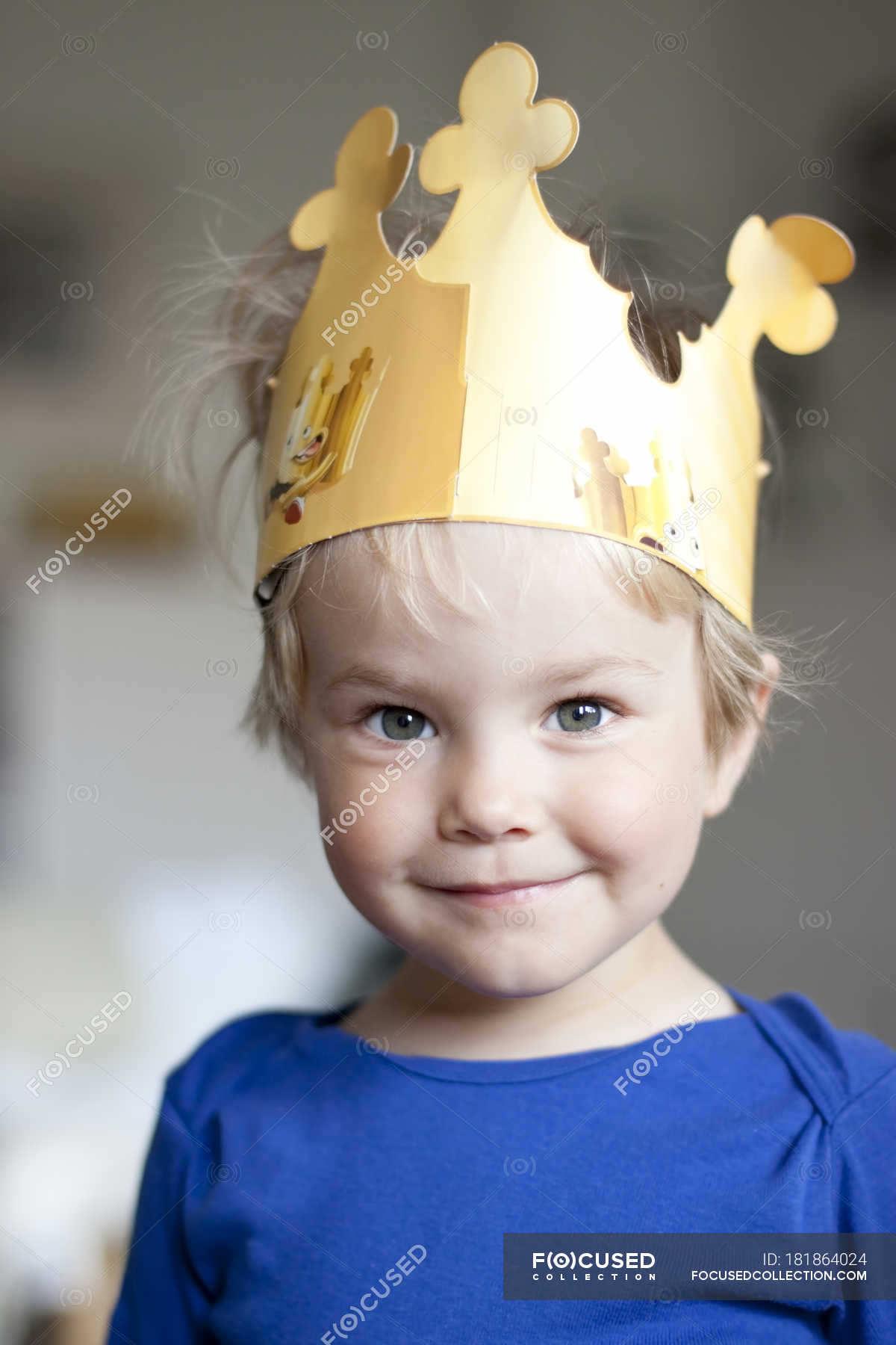 Smiling little girl wearing a crown looking at camera — short haircut ...