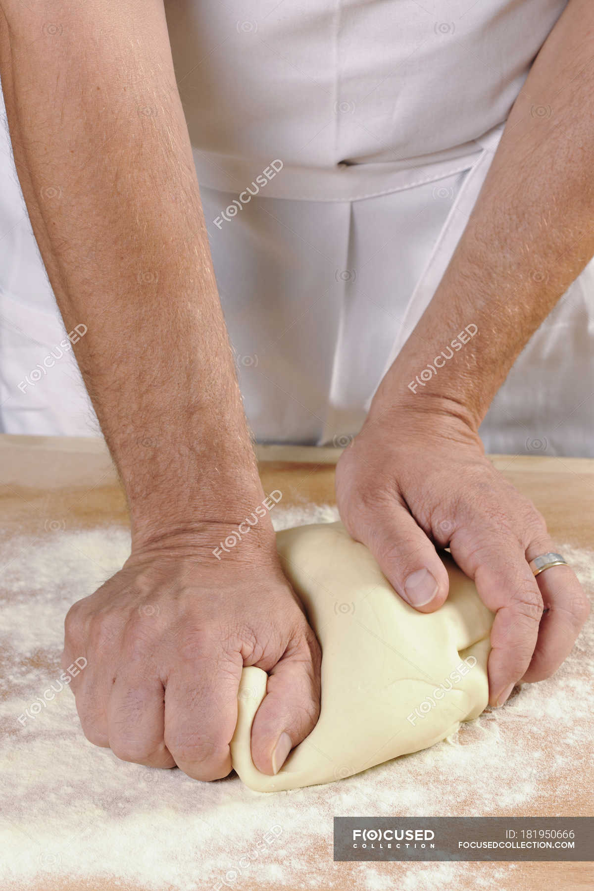 hands-of-a-man-kneading-pasta-dough-for-home-made-tortelloni-food-and