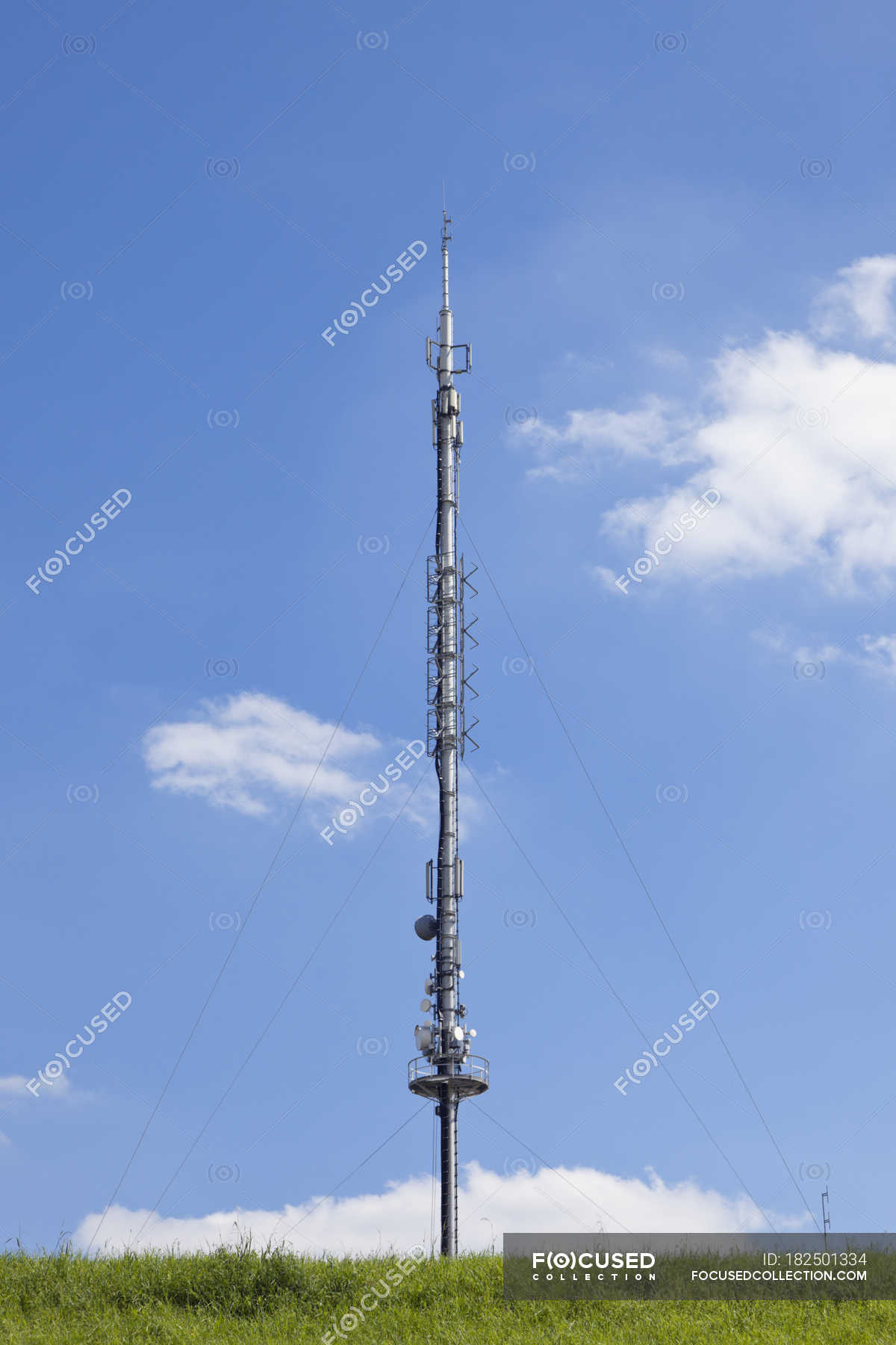 Germany, radio and television antenna and blue sky with clouds on  background — communication technology, daytime - Stock Photo | #182501334