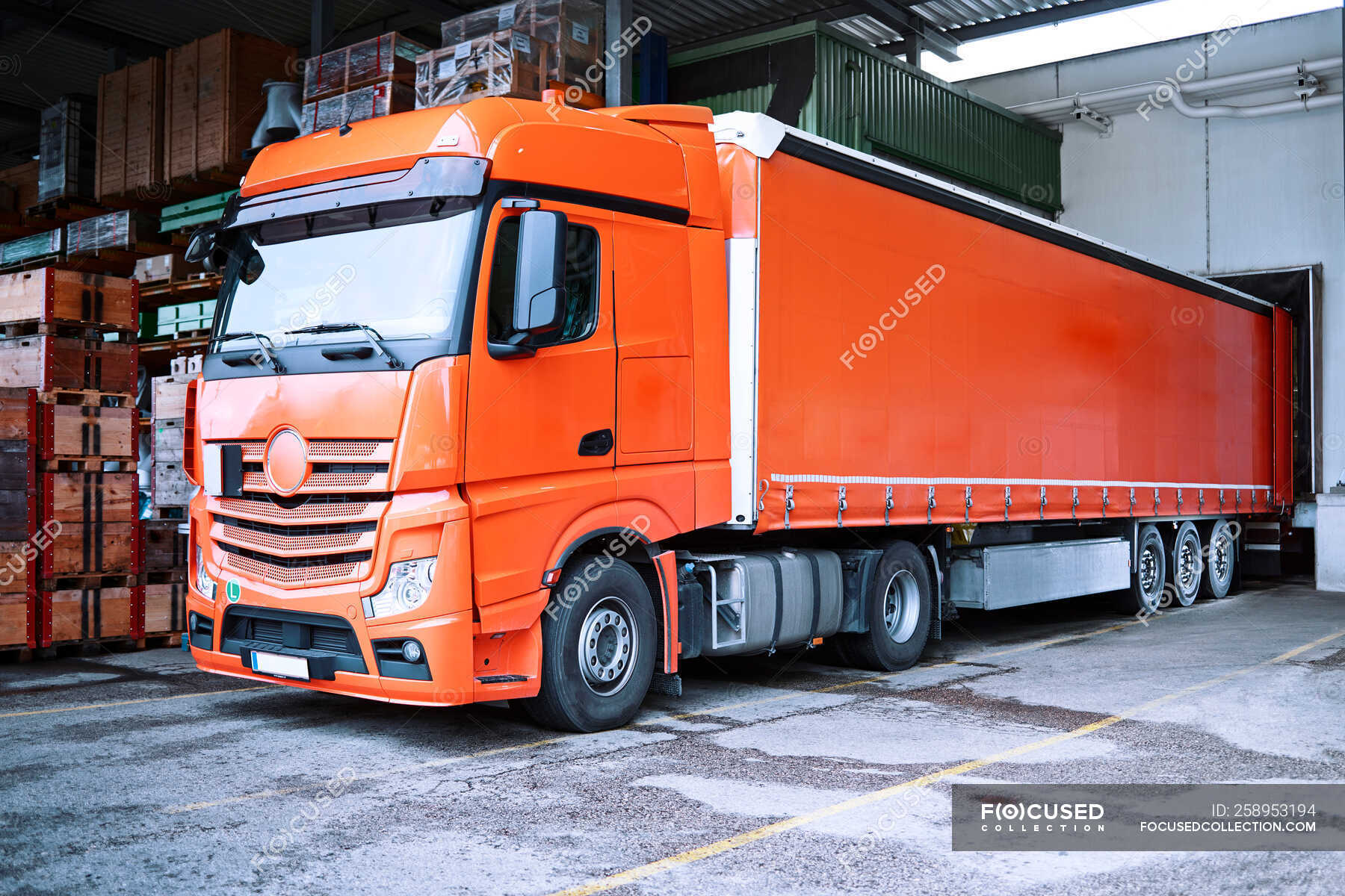 truck-at-loading-bay-orange-freight-stock-photo-258953194