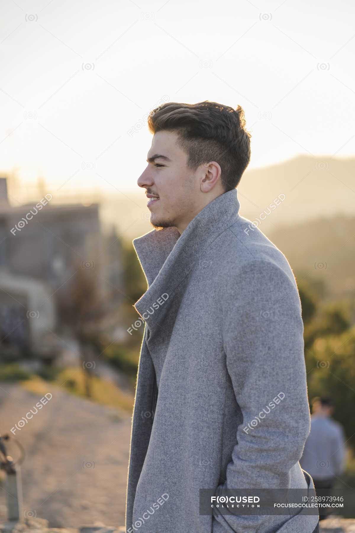 Fashionable Young Man Wearing Grey Coat Side View Brown Hair