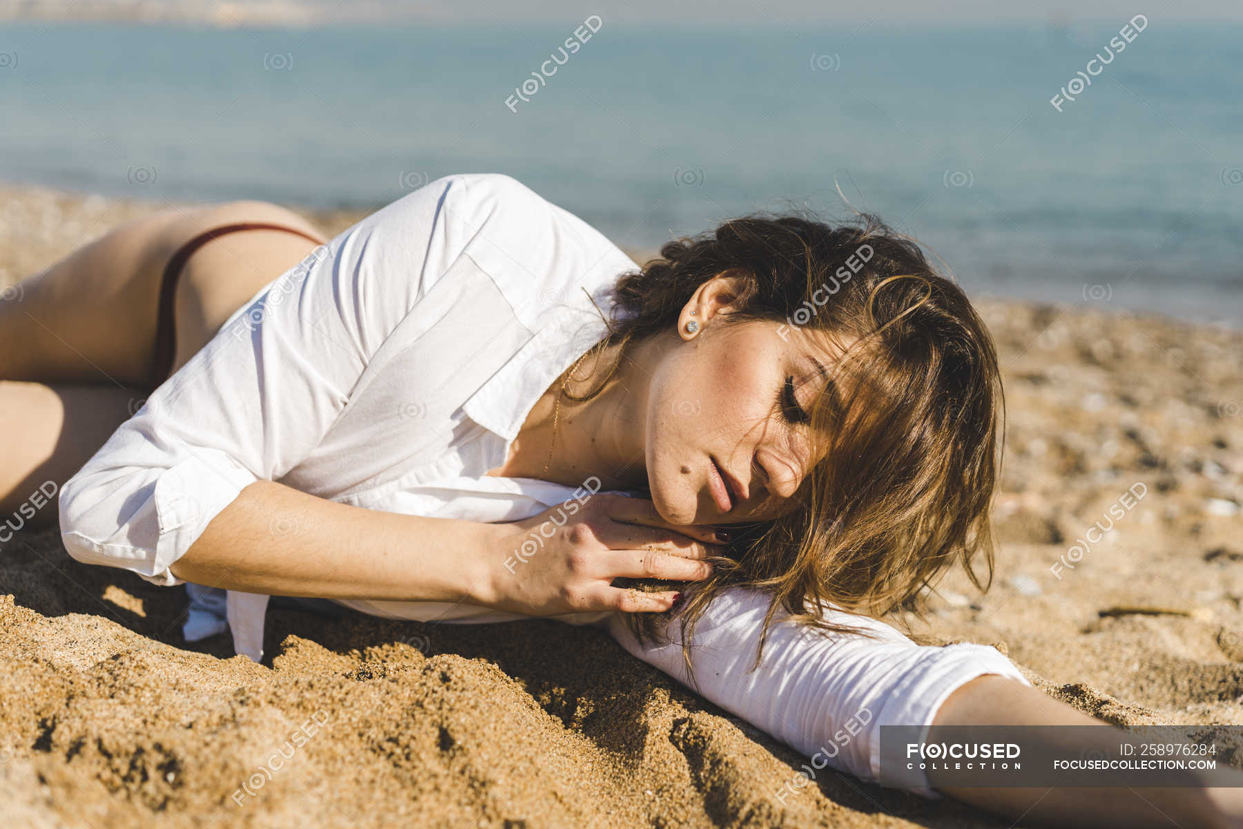Woman lying on beach