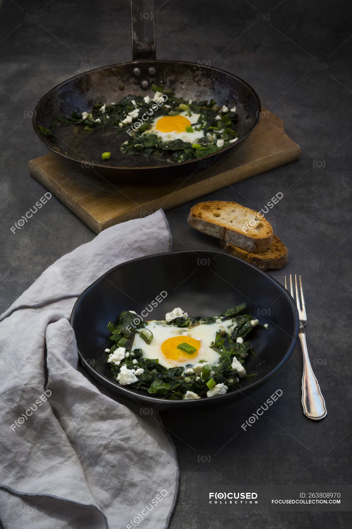 Green Shakshouka With Baby Spinat Chard Spring Onions And Basil Wooden Board Jewish Stock Photo