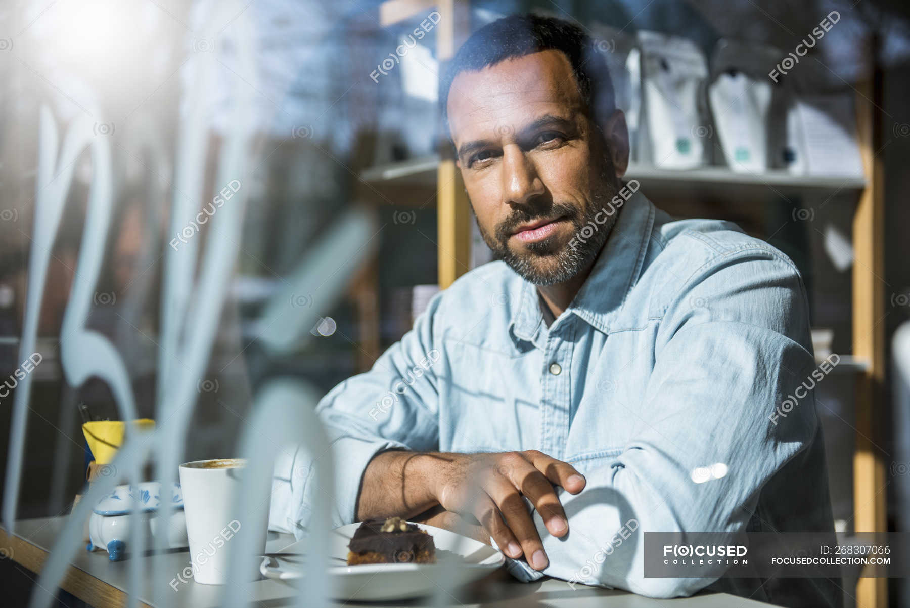 Portrait Of Man With Piece Of Cake In A Cafe Coffee Sitting Stock Photo 268307066