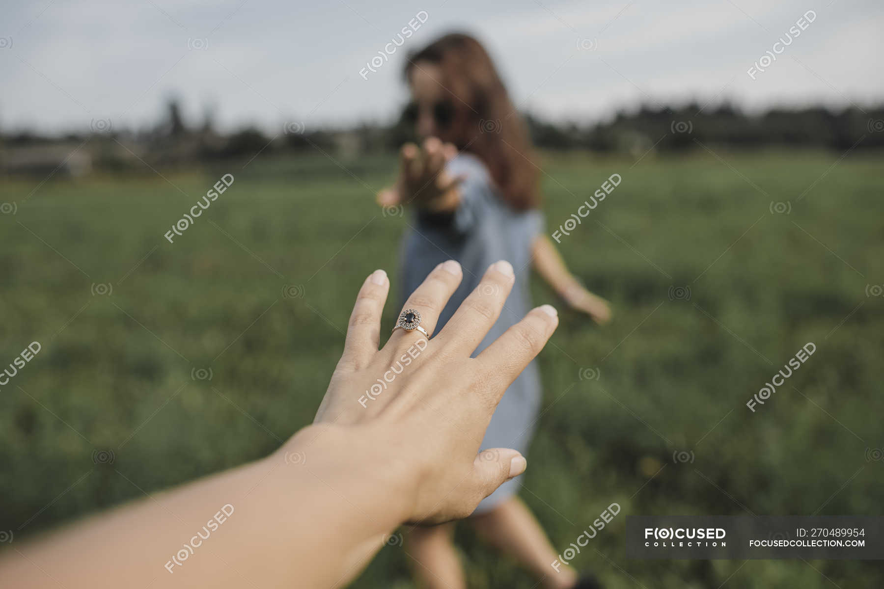 Hand Reaching Out For Woman On A Field — 40 50 Years Relationship