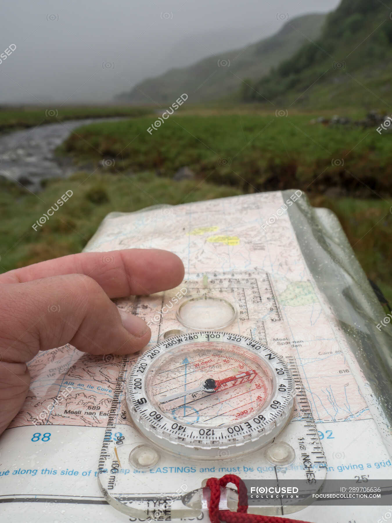 Great Britain, Scotland, Knoydart Peninsula, Hand holding compass and ...