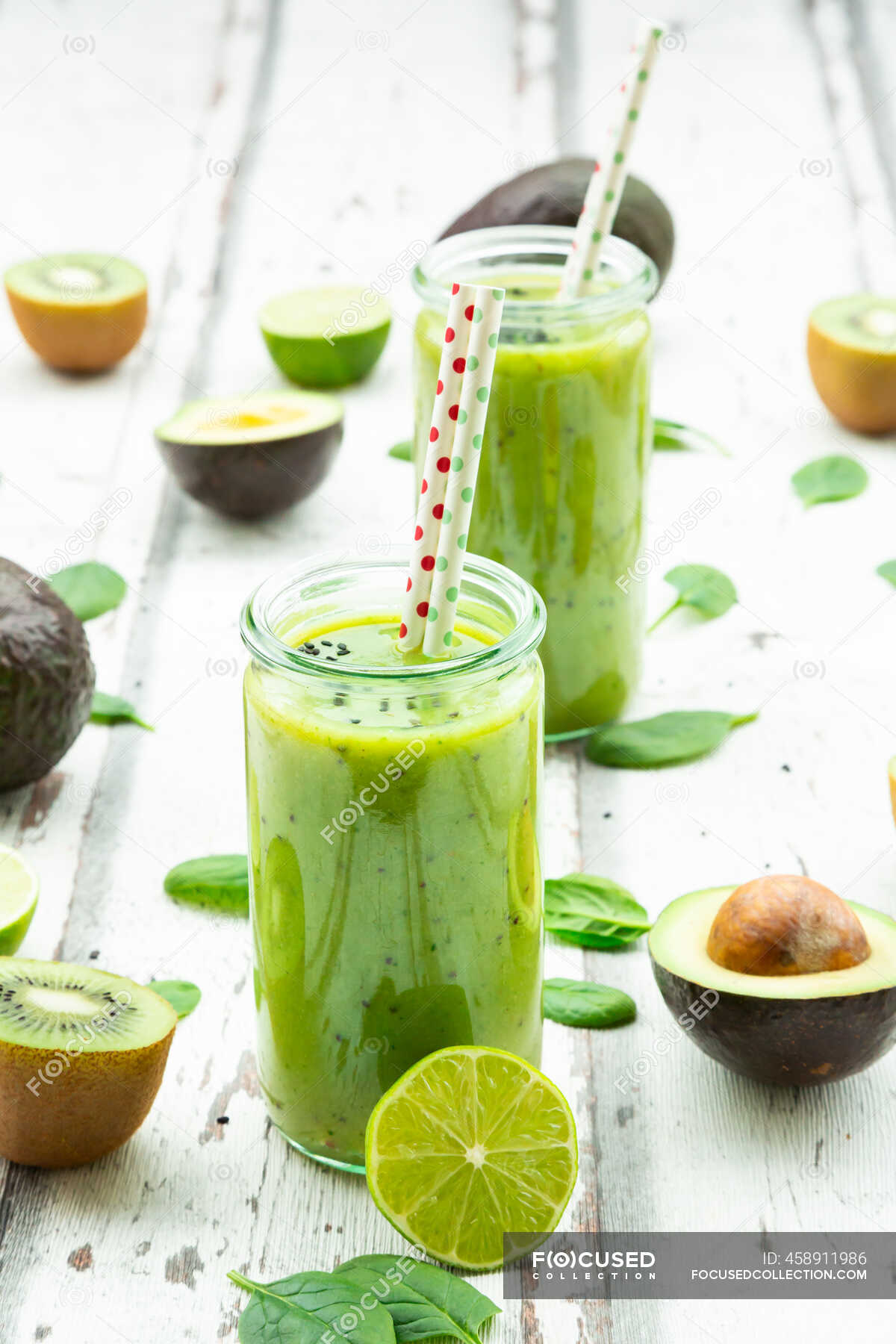 Two glasses of green smoothie with avocado, spinach, kiwi and lime — still  life, sliced - Stock Photo | #458911986