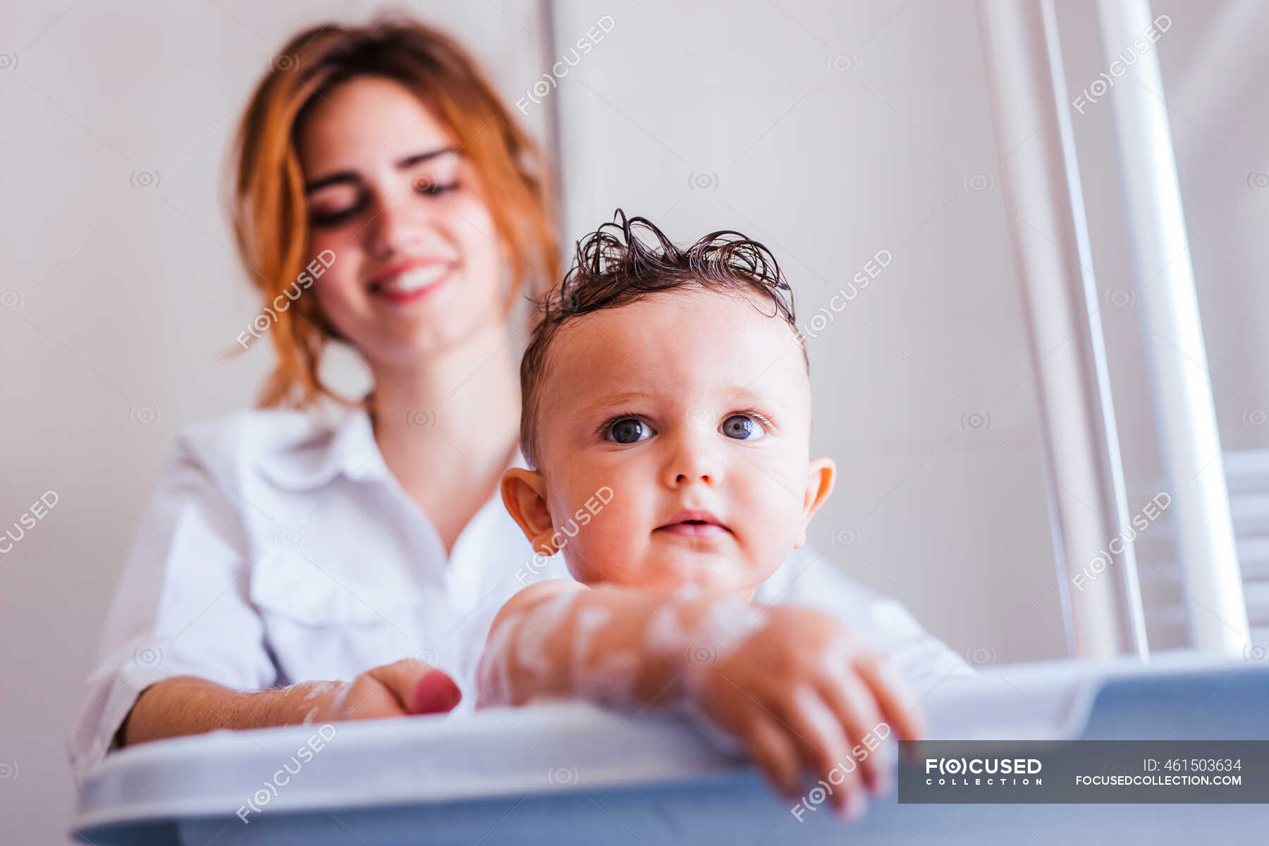 wife bathing and son
