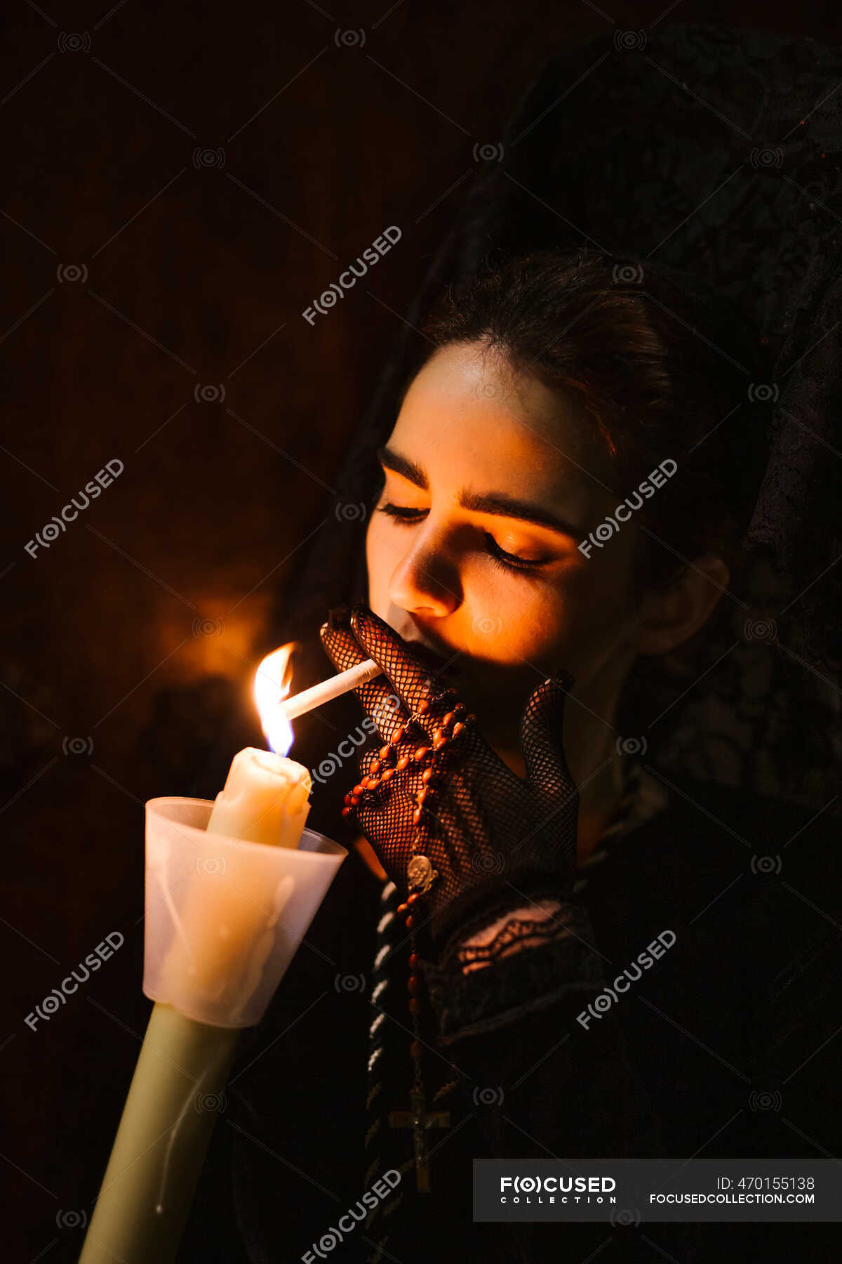 beautiful women lighting cigarettes