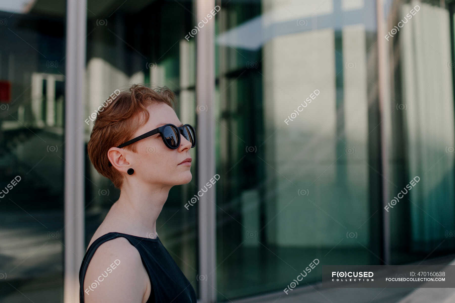 Elegant Red Haired Woman With Sunglasses In The City Portrait