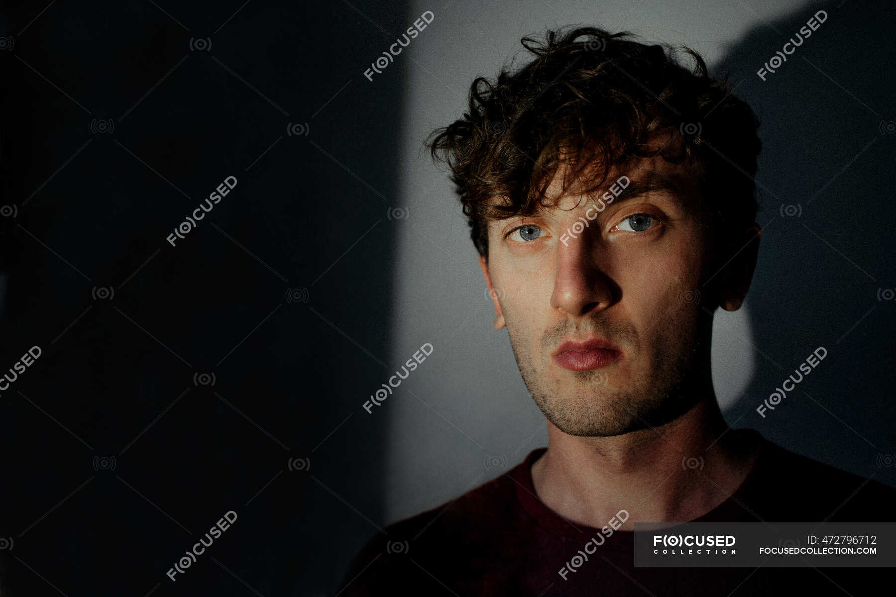 portrait-of-serious-young-man-available-light-20-30-years-stock