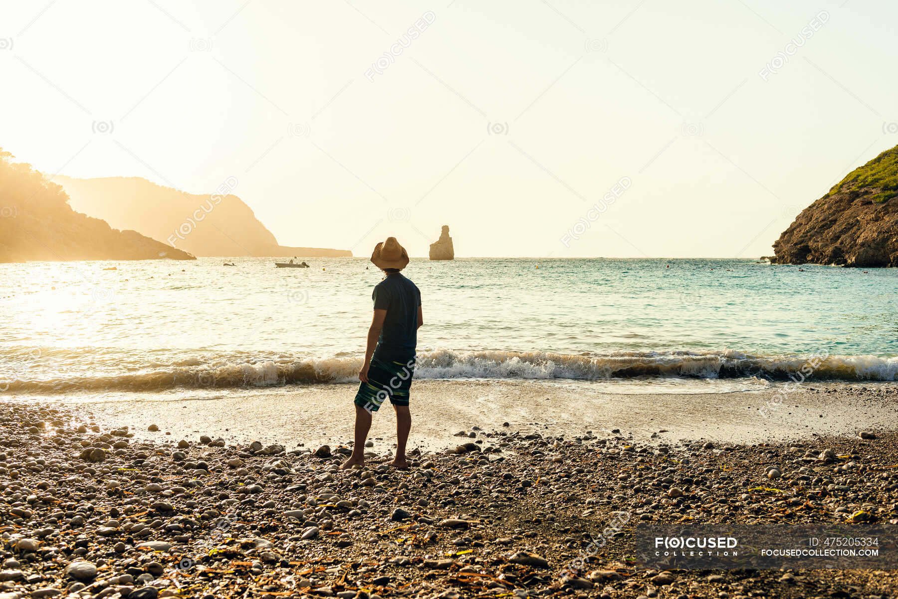 Man on his back of the beach in the sea — mediterranean coast, horizon ...