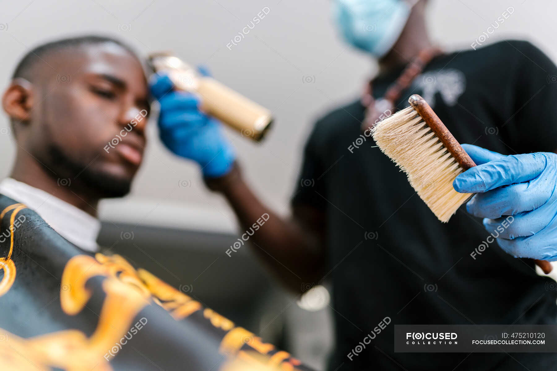 Focused 475210120 Stock Photo Barber Wearing Gloves Holding Brush 