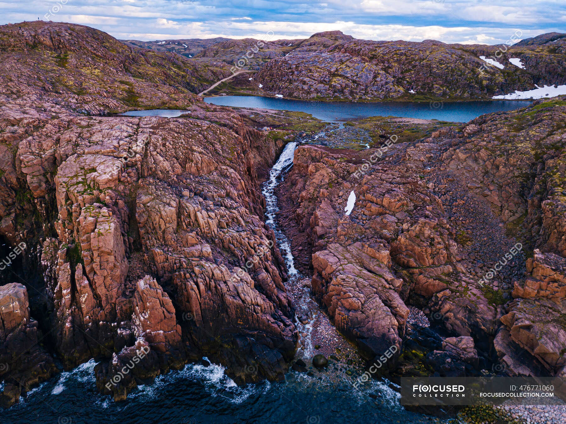 Russia, Murmansk Oblast, Teriberka, Aerial view of waterfall at coast