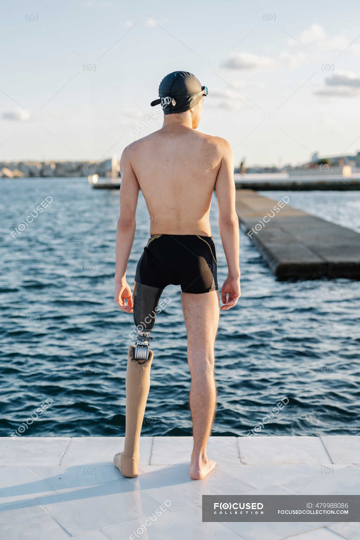 Amputee Male Looking At Sea While Standing On Promenade During Sunny Day Leisure Outdoors