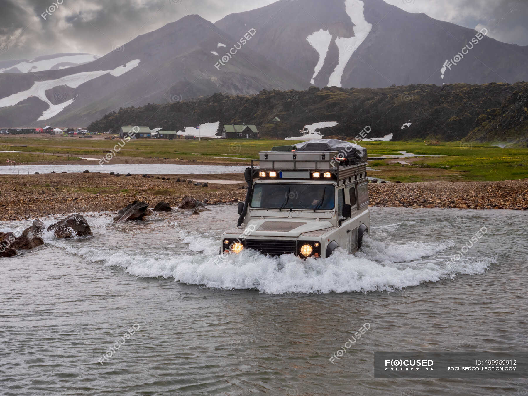 Off Road Vehicle Moving In Lagoon At Landmannalaugar — Caucasian