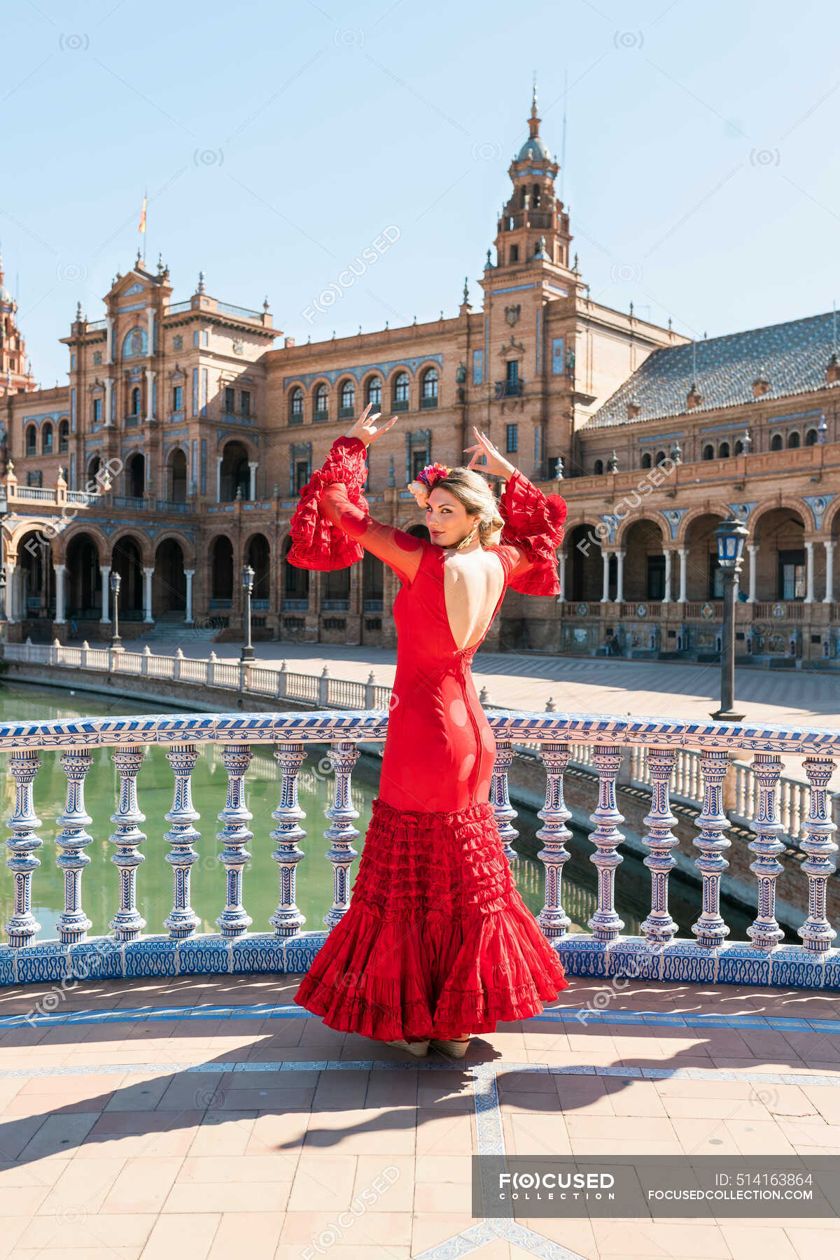 female-flamenco-dancer-dancing-with-hands-raised-at-plaza-de-espana-in