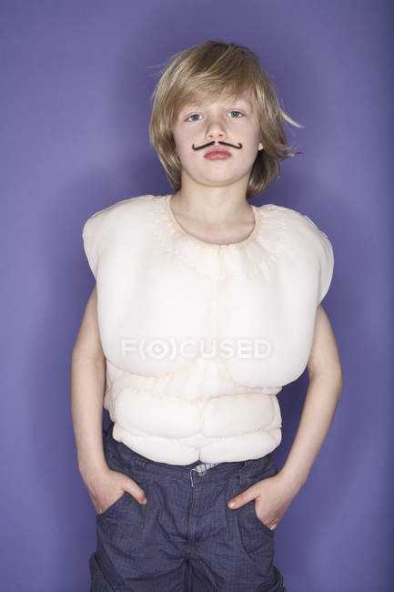 Boy dressed up as muscleman — Stock Photo