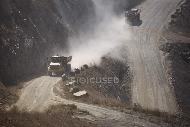 Trucks driving in quarry — Stock Photo