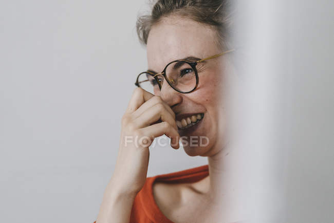 Woman with glasses laughing — Stock Photo
