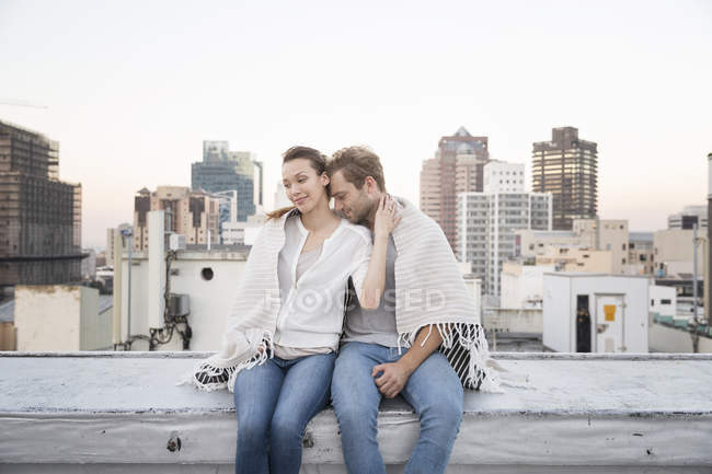 Couple enjoying the view on rooftop — Stock Photo