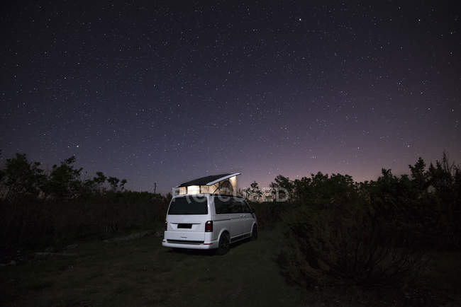 Camper With Roof Tent In The Nature Under Starry Sky Sunset Independence Stock Photo