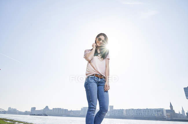 Woman standing at River Rhine — Stock Photo