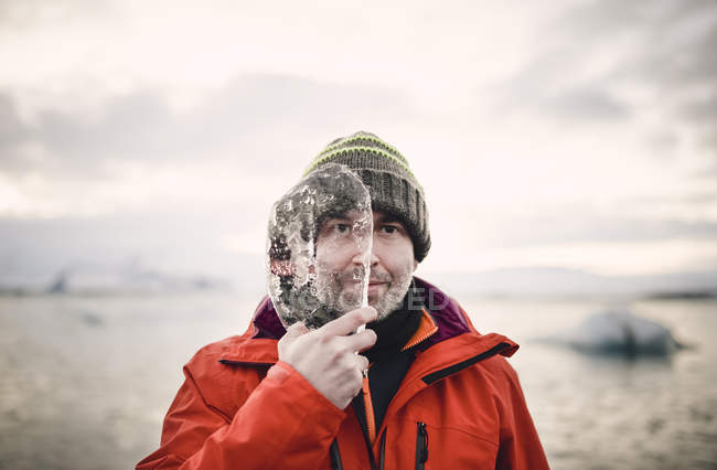 Man with a piece of ice — Stock Photo