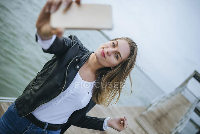 Young woman taking selfie — Stock Photo