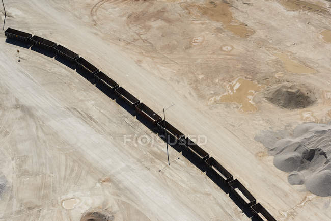 Sand mine with unloaded rail cars — Stock Photo