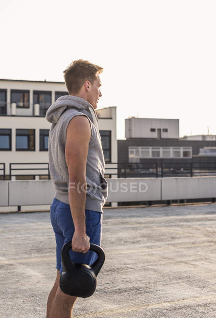 Man exercising with kettle bell — Stock Photo
