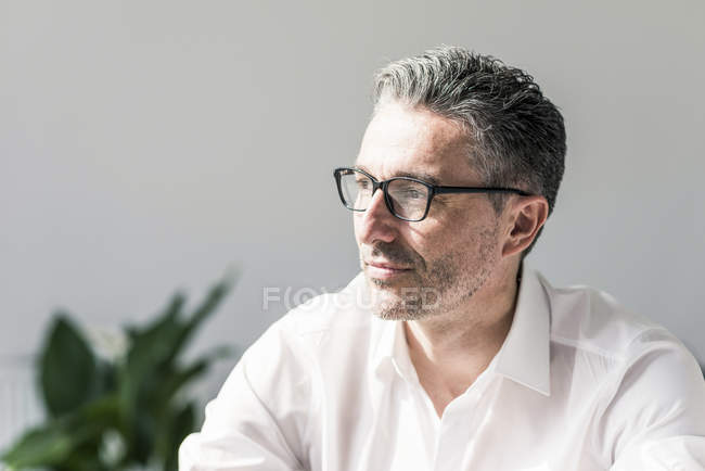 Pensive businessman with stubble — Stock Photo