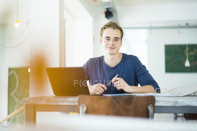 Student working with laptop — Stock Photo