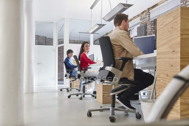 Business people working in creative office — Stock Photo