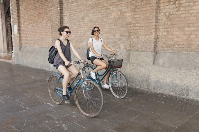 women riding bicycles