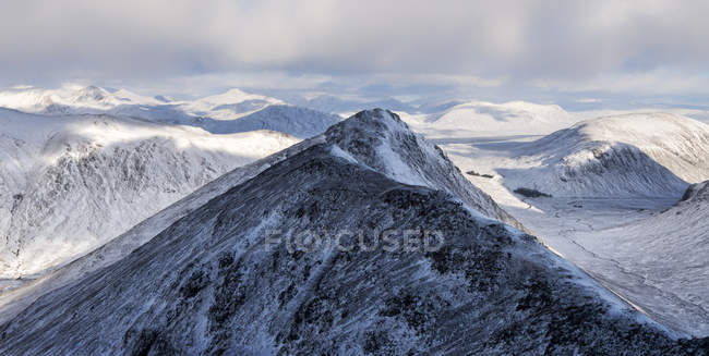 UK, Scotland, Glencoe, snow-covered Buachaill Etive Beag mountain — Stock Photo