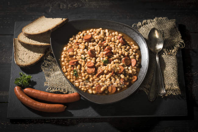 Plate of bean goulash with Debrecener — Stock Photo