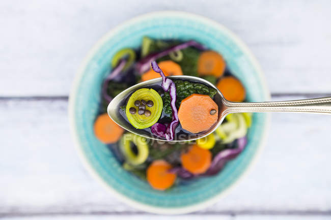 Spoon of vegan cabbage stew — Stock Photo