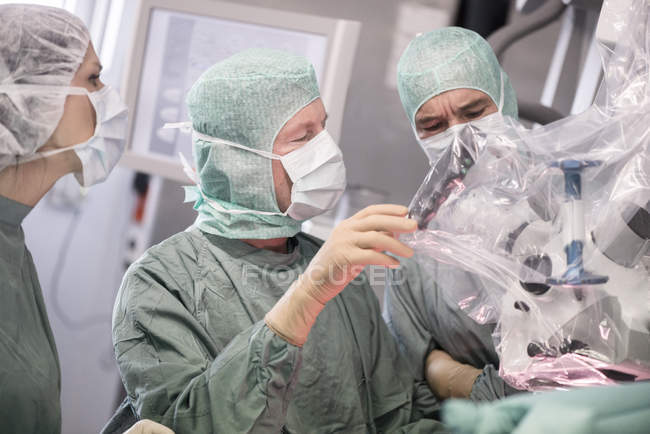 Cropped portrait of doctors during a neurosurgical operation — Stock Photo